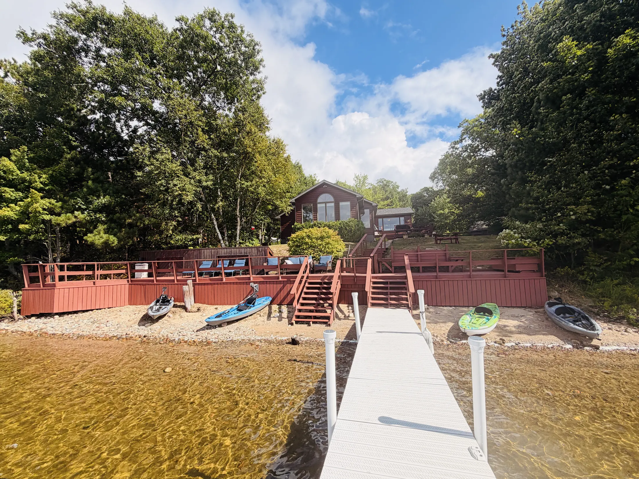 Private dock and guest kayaks on the shoreline