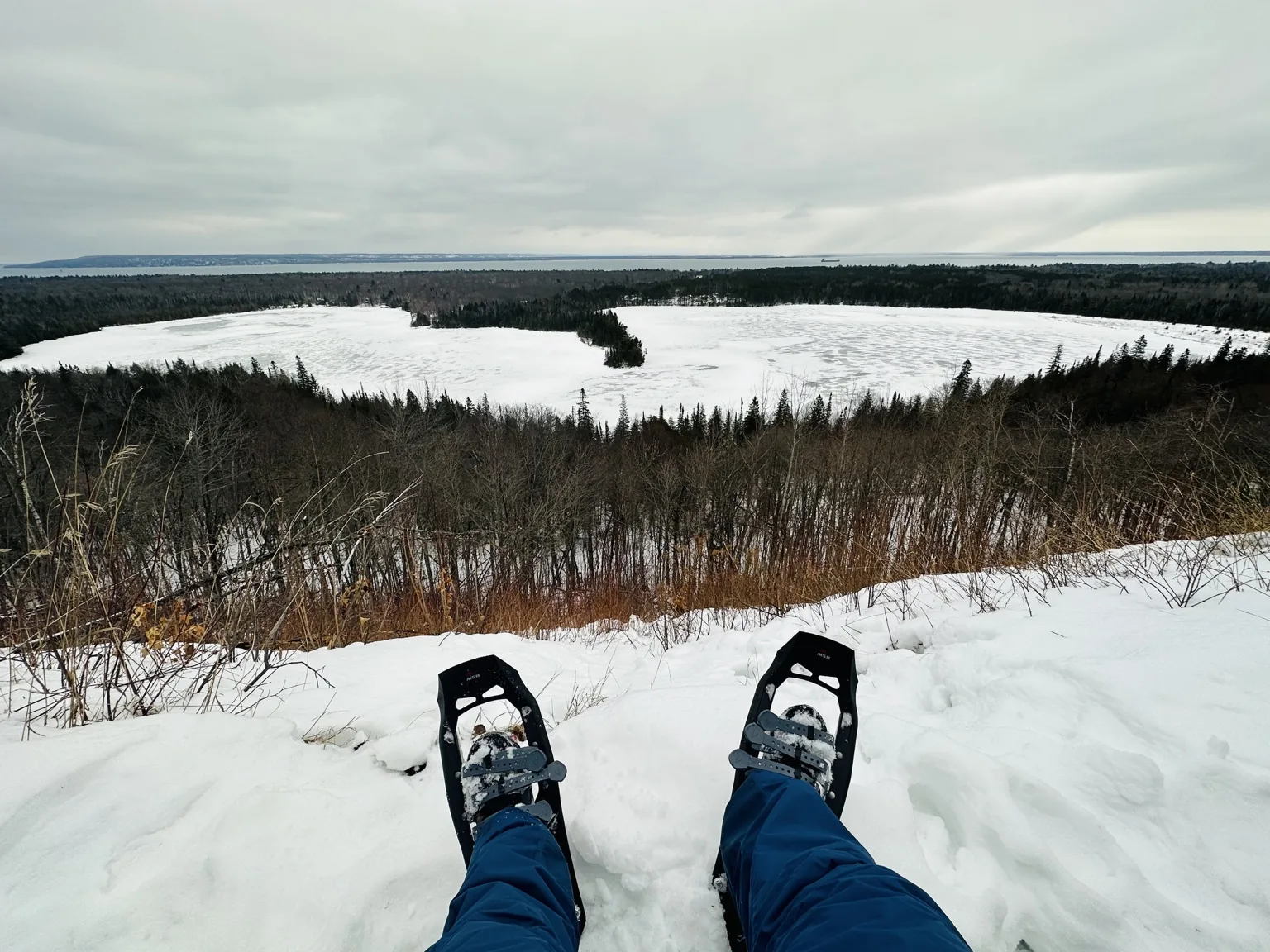 Snowshoe view over a wintry lake