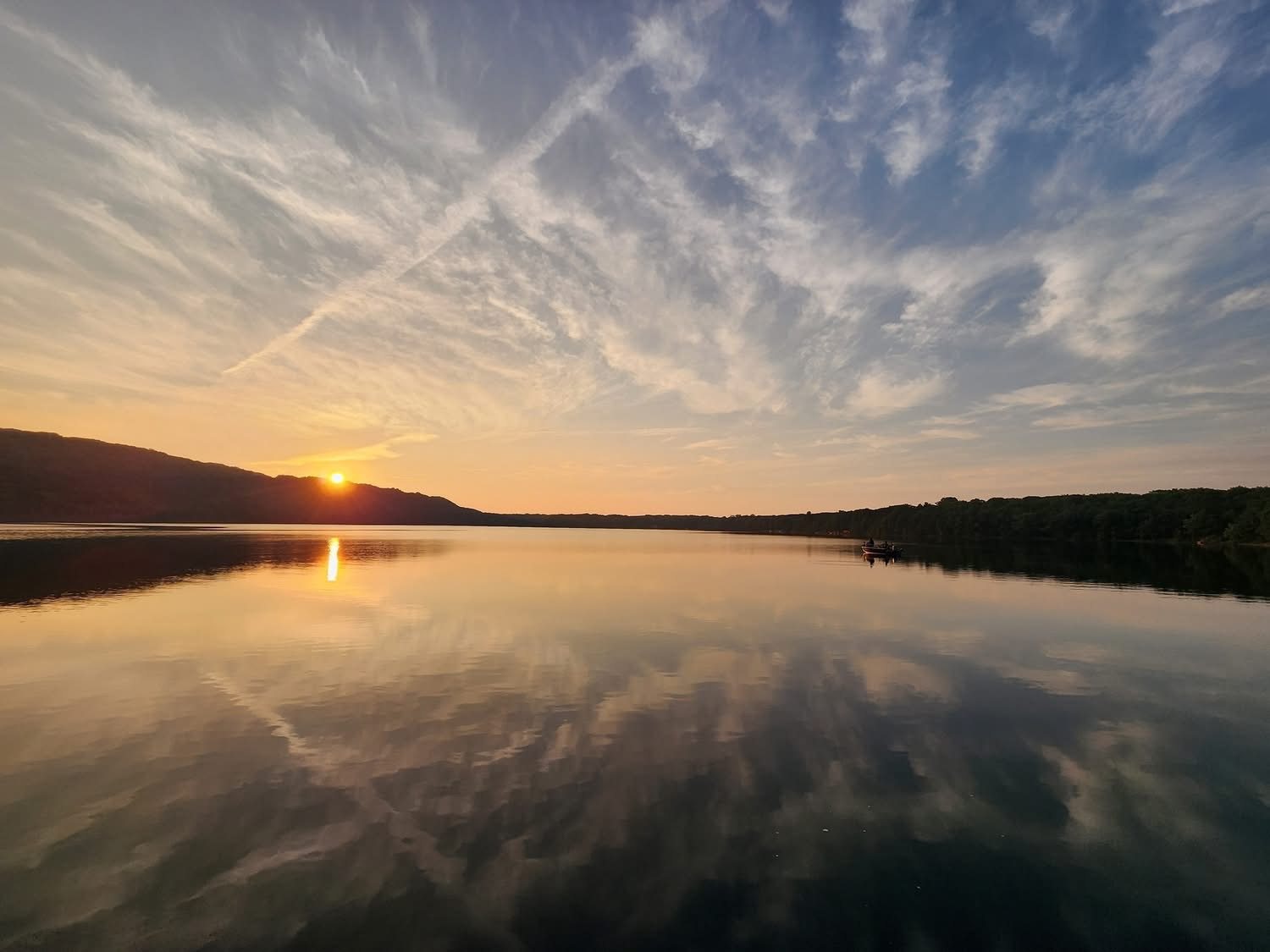 Sunset reflected over the water near The Loon Hollow