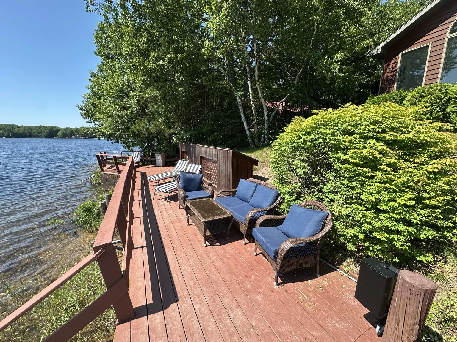Waterfront deck seating along Monocle Lake