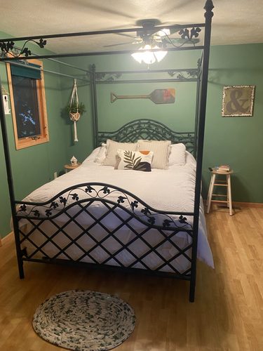 Canopy bedroom with rustic lake style
