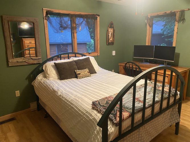 Forest Suite bedroom with deep green walls