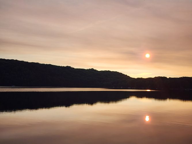 Calm sunset reflections on Monocle Lake