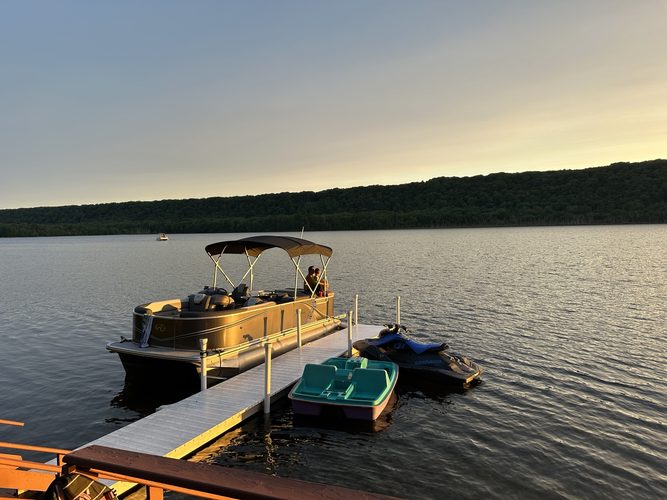 Dock, pontoon and water toys at golden hour